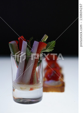 Elegant digestive appetizers close up isolated on illuminated surface Elegant digestive appetizers close up isolated on illuminated surface 138604287