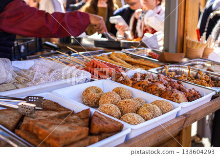 Chinese street food and fried snacks sold at Spring Festival and Lunar New Year events. Chinese street food and fried snacks sold at Spring Festival and Lunar New Year events. 138604293