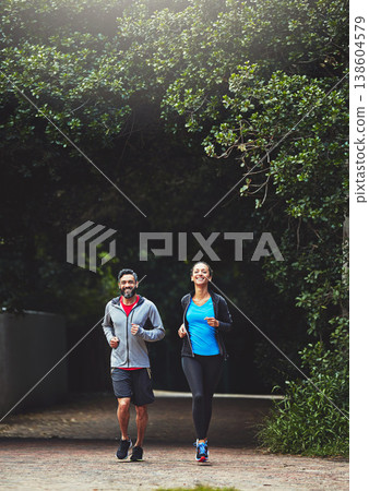 Couple in park, running together and fitness in nature, exercise and training for marathon with bonding and sports. People workout, cardio outdoor for health and wellness with runner and challenge 138604579