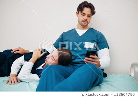 Tired, nurses and break with phone in hospital or sleeping on bed in clinic with friends, fatigue and support. Relax, reading and care for mental health in healthcare with doctors or medical staff 138604796