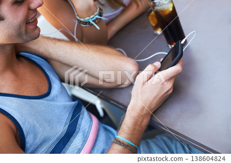 Smile, cafe and a man with a phone for music, listening to a podcast or watching a video. Happy, social media and a person with a mobile for a radio app, sound or streaming audio at a restaurant Smile, cafe and a man with a phone for music, listening to a podcast or watching a video. Happy, social media and a person with a mobile for a radio app, sound or streaming audio at a restaurant 138604824
