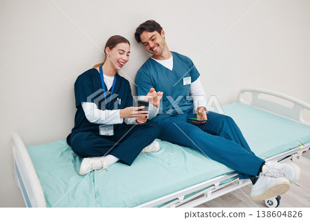 Doctors, smartphone and break on hospital bed, relax and happy from healthcare service, job and career. Nurse, man and woman for rest, shift and employee for social media, memes and communication Doctors, smartphone and break on hospital bed, relax and happy from healthcare service, job and career. Nurse, man and woman for rest, shift and employee for social media, memes and communication 138604826