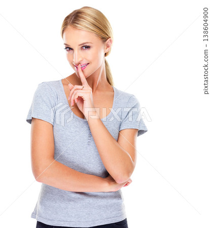 Secret, portrait and woman with finger on lips in studio for privacy sign, confidential mystery and surprise on white background. Happy model show quiet emoji for gossip, news or whisper announcement Secret, portrait and woman with finger on lips in studio for privacy sign, confidential mystery and surprise on white background. Happy model show quiet emoji for gossip, news or whisper announcement 138604900