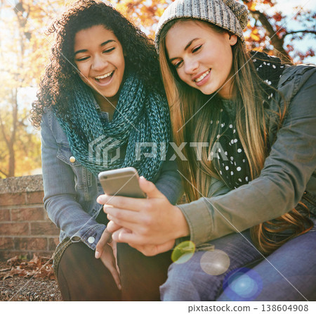 Phone meme, laugh or friends in park with smile together for holiday vacation outdoors on social media. Happy people, gossip or gen z girls in nature talking, speaking or streaming at a comedy joke 138604908