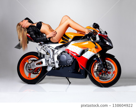 Sexy, leather jacket and woman in bikini on motorbike in studio isolated on a white background. Body, blonde model in swimsuit and motorcycle for fashion style, freedom to travel and beauty of legs Sexy, leather jacket and woman in bikini on motorbike in studio isolated on a white background. Body, blonde model in swimsuit and motorcycle for fashion style, freedom to travel and beauty of legs 138604922