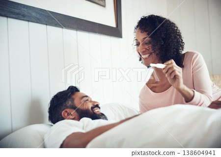 Couple, surprise and happy with pregnancy test, positive and bed with smile, results and excited. Man, woman and baby with stick, love and maternity for future family, bedroom and pregnant together Couple, surprise and happy with pregnancy test, positive and bed with smile, results and excited. Man, woman and baby with stick, love and maternity for future family, bedroom and pregnant together 138604941