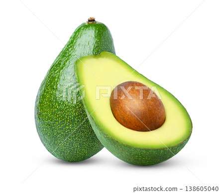 Green fresh ripe avocado and cut in a half isolated. 138605040