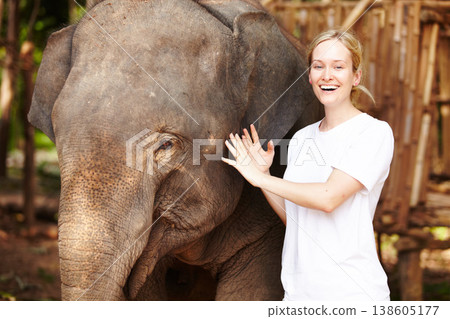 Travel, freedom and portrait of woman with elephant in a forest for vacation, trip or holiday. Nature, bucket list and face of female traveler with animal in a park for adventure on Thailand journey 138605177