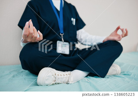 Doctor, yoga and meditate to relax in hospital, healing and break from work, closeup in calm for mental health. Medical professional, peace and hands for aura, zen and chakra for balance in career 138605223