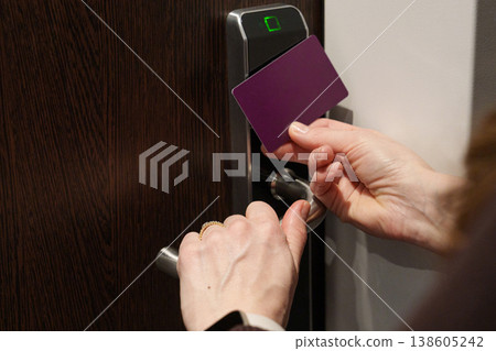 Opening door with key card and handle in hotel room Opening door with key card and handle in hotel room 138605242