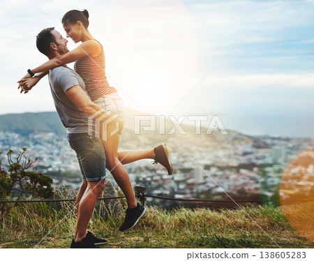 Care, lift or happy couple hug in nature for date, love or trust with support, bond or freedom. Eye contact, romantic man or woman excited by holiday vacation together to celebrate, relax or travel 138605283