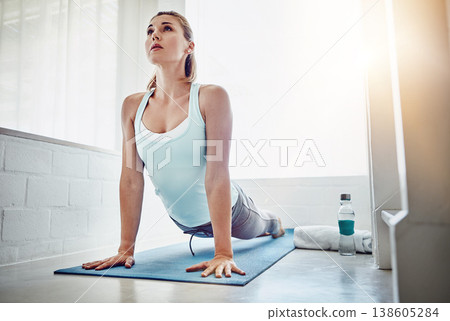 Yoga, stretching and woman in home exercise, meditation and zen fitness or holistic training for muscle health. Flexible, sports person in upward facing dog pose for body wellness, plank and training Yoga, stretching and woman in home exercise, meditation and zen fitness or holistic training for muscle health. Flexible, sports person in upward facing dog pose for body wellness, plank and training 138605284