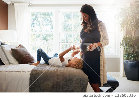 Happy family bedroom, pregnant woman and kid touch stomach, abdomen or belly for baby care, development or maternity. Mother, young girl and child check life growth, pregnancy or movement on home bed 138605330