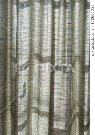 Curtains bathed in the morning sunlight 138605353