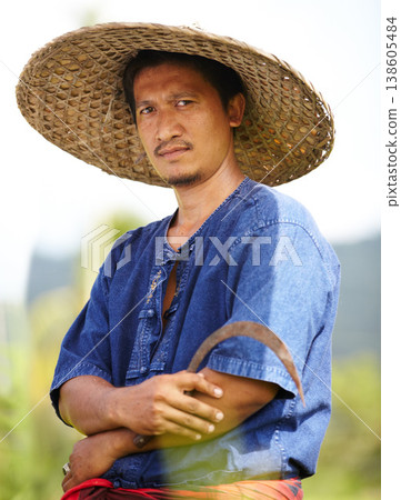 Asian man, portrait and straw hat of farmer for agriculture, wheat or harvest on rice field in nature. Male person or Thai with arms crossed on farm for professional harvesting, crops or natural land Asian man, portrait and straw hat of farmer for agriculture, wheat or harvest on rice field in nature. Male person or Thai with arms crossed on farm for professional harvesting, crops or natural land 138605484