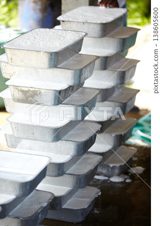 Rubber, manufacturing and container with material in workshop, factory and production warehouse. Business, plantation and package on table for industrial process, plastic and resource in Thailand Rubber, manufacturing and container with material in workshop, factory and production warehouse. Business, plantation and package on table for industrial process, plastic and resource in Thailand 138605600