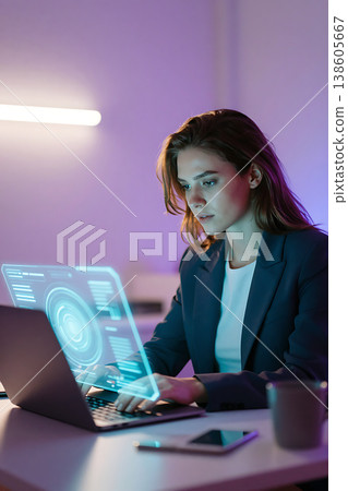 Businesswoman working at laptop with holographic artificial intelligence interface. Futuristic concept of digital transformation, big data analysis and innovation in modern office. 138605667