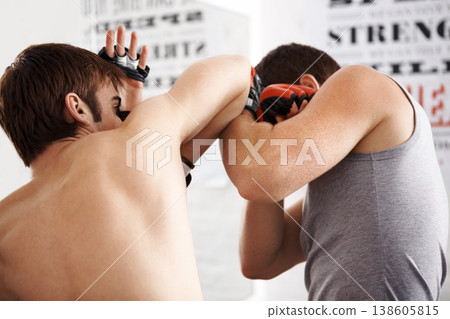 Man, fighting and martial arts with elbow block or sparring partner for self defense techniques at dojo. Male person or fighter in kick boxing, karate or MMA for jujitsu, protection or guard at gym 138605815