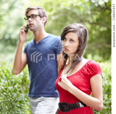 Couple fight, phone call and woman frustrated by cheating man, liar or bored with relationship in a park. Smartphone, conflict and annoyed female rolling eyes for workaholic boyfriend in a forest Couple fight, phone call and woman frustrated by cheating man, liar or bored with relationship in a park. Smartphone, conflict and annoyed female rolling eyes for workaholic boyfriend in a forest 138605937