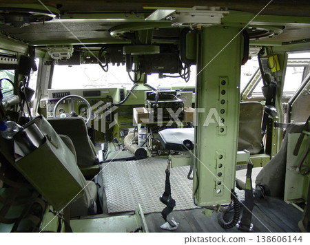 Military, army and interior of vehicle or transport for mission, training or battle with equipment or background. Transportation, van and inside for service, navigation or operation with armed forces 138606144