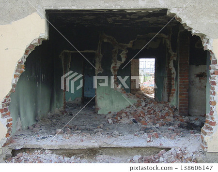 Building, warzone and destruction of a home during military conflict or turmoil during battle. Hole, damage and wall of a housing structure on a battlefield in Israel or Palestine during war Building, warzone and destruction of a home during military conflict or turmoil during battle. Hole, damage and wall of a housing structure on a battlefield in Israel or Palestine during war 138606147