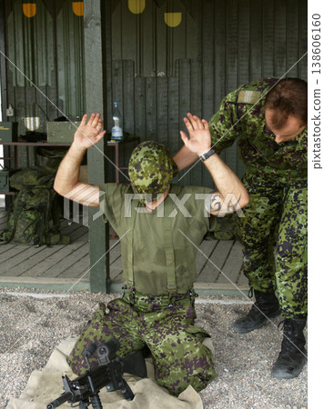 Military, exam to assemble a gun with a man soldier outdoor in camouflage uniform for an exercise. Army, blindfold and a person training at bootcamp to build a weapon or rifle in record time Military, exam to assemble a gun with a man soldier outdoor in camouflage uniform for an exercise. Army, blindfold and a person training at bootcamp to build a weapon or rifle in record time 138606160