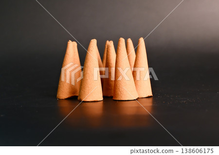 incense sandalwood cones on black background 138606175
