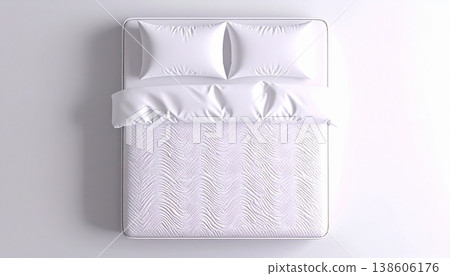 An overhead view of a minimalist bed with a white pillow and clean sheets. 138606176