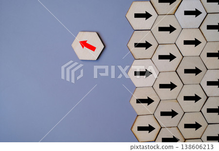 Concept of individuality and standing out, with a red arrow moving opposite to black arrows Concept of individuality and standing out, with a red arrow moving opposite to black arrows 138606213