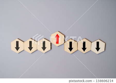 Individuality and bold direction concept with a red arrow pointing opposite to black arrows on wooden blocks Individuality and bold direction concept with a red arrow pointing opposite to black arrows on wooden blocks 138606214