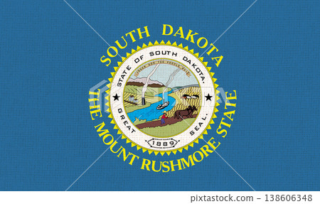 Flag of South Dakota state on fabric surface. South Dakota state flag Flag of South Dakota state on fabric surface. South Dakota state flag 138606348