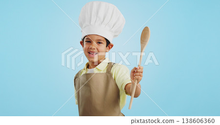 Happy, face and child with a spoon for baking, young chef or getting ready for the kitchen. Smile, boy kid or portrait with equipment for cooking, future career or preparation on a studio background Happy, face and child with a spoon for baking, young chef or getting ready for the kitchen. Smile, boy kid or portrait with equipment for cooking, future career or preparation on a studio background 138606360