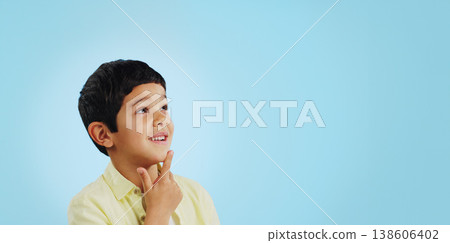 Surprise, boy and child with decision, thinking and brainstorming on a blue studio background. Ideas, mockup space and happy kid looking up, future and announcement with planning, choice and emoji Surprise, boy and child with decision, thinking and brainstorming on a blue studio background. Ideas, mockup space and happy kid looking up, future and announcement with planning, choice and emoji 138606402