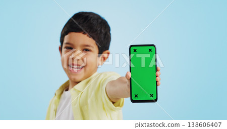 Kid, face or phone green screen in studio on social media for ecommerce, tech or download app logo. Blue background, space or happy child with notification for online marketing, mockup or advertising Kid, face or phone green screen in studio on social media for ecommerce, tech or download app logo. Blue background, space or happy child with notification for online marketing, mockup or advertising 138606407