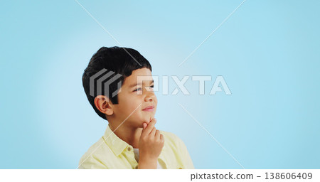 Thinking, inspiration and ideas, confused youth boy in studio with future or solution on blue background. Why, question with problem solving and remember, mockup space with kid insight and memory or 138606409