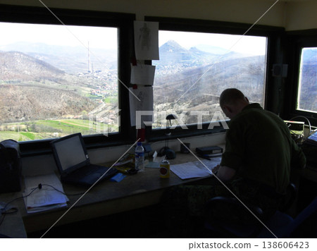 Radio tower, air traffic control and a man at his desk to monitor the airways with a view of the sky. Airport, aviation and navigation with a person working on flight strategy or direction of travel 138606423