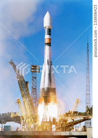 Rocket launch into sky, travel and space mission for research, exploration and discovery in cosmos. Science, aerospace innovation or technology, spaceship in flight at ground site with flame and fuel 138606425