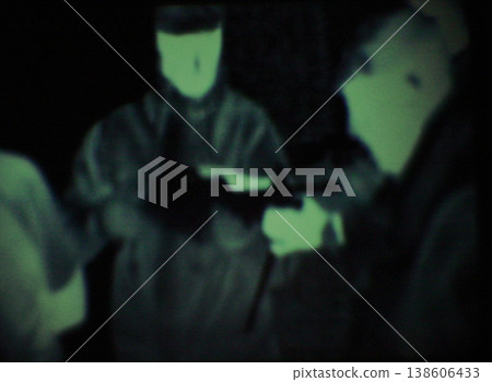 Night vision, army group and team planning, discussion or battlefield conversation or military mission. Battle soldier, teamwork and people talk about plan, strategy or Ukraine war tactics and scope Night vision, army group and team planning, discussion or battlefield conversation or military mission. Battle soldier, teamwork and people talk about plan, strategy or Ukraine war tactics and scope 138606433