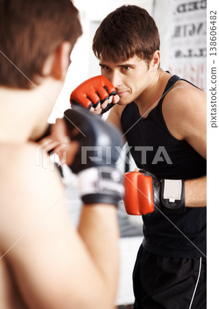 Man, fighting and boxing in martial arts training with sparring partner for self defense techniques at dojo. Male person, athlete or boxer ready for fight, karate or MMA in jujitsu or match in ring Man, fighting and boxing in martial arts training with sparring partner for self defense techniques at dojo. Male person, athlete or boxer ready for fight, karate or MMA in jujitsu or match in ring 138606482