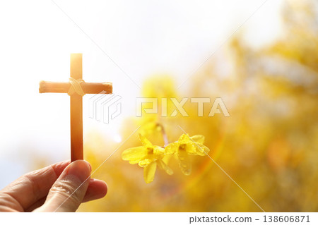 The Cross of Jesus Christ and beautiful forsythia spring background, Passion Week and Easter concept 138606871