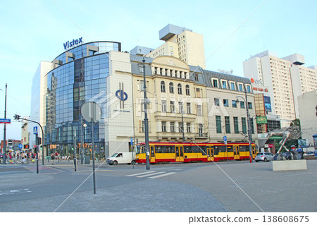 Red tram going on street of Lodz. Colored tramway going along city Red tram going on street of Lodz. Colored tramway going along city 138608675