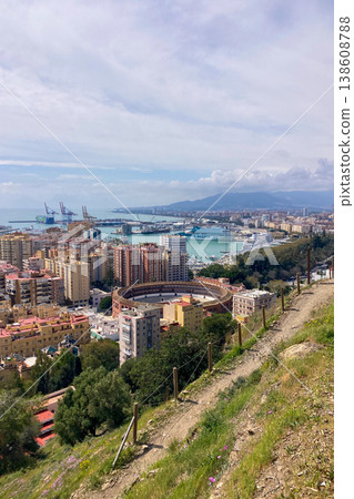 Panoramic view of Malaga port with marina, ships and waterfront architecture under clear coastal light in Malaga, Spain. Panoramic view of Malaga port with marina, ships and waterfront architecture under clear coastal light in Malaga, Spain. 138608788