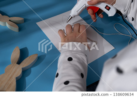 Easter bunny made of rope using hot glue Reindeer fingerprints Sustainable Christmas preparation Diy process of making handmade greeting cards. Step by step activity for children. Inclusive and 138609634