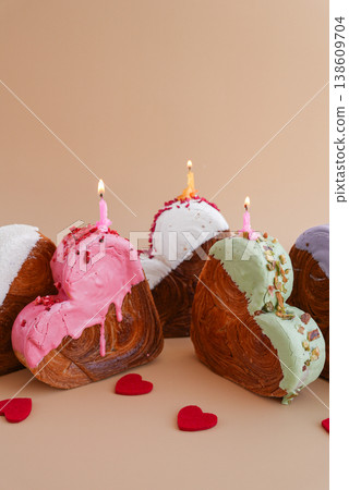 Holiday celebration with candles Heart shaped different variety flavor croissants on beige background with copy space. Puff pastry new trendy sweet dessert bakery. Creamy dough 138609704