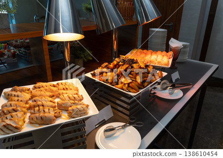 Catering buffet with roasted potatoes 138610454