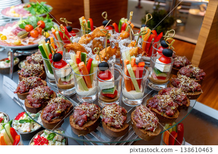 Elegant catering buffet with beef tartare canapes 138610463