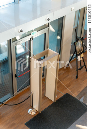 Modern building entrance with security metal detector gates Modern building entrance with security metal detector gates 138610483