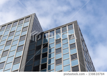 Skyscraper building architecture. Skyscraper with glassy exterior. Modern city perspective. Skyscraper in business city. City downtown with skyscraper in perspective. Perspective view Skyscraper building architecture. Skyscraper with glassy exterior. Modern city perspective. Skyscraper in business city. City downtown with skyscraper in perspective. Perspective view 138610784