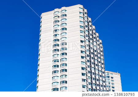 Architecture of modern residential building. Perspective city skyscraper. Modern building. Architectural building in metropolis. Residential building perspective. City architecture. Luxury apartments Architecture of modern residential building. Perspective city skyscraper. Modern building. Architectural building in metropolis. Residential building perspective. City architecture. Luxury apartments 138610793