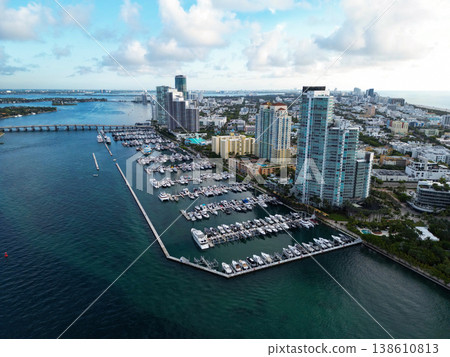 Luxurious yacht marina. Luxury boat harbor. Marina in Miami Beach, Florida USA. Yacht boat docked on sea Biscayne bay. Downtown Miami Marina with luxury yacht boat. Summer vacation. Aerial skyline Luxurious yacht marina. Luxury boat harbor. Marina in Miami Beach, Florida USA. Yacht boat docked on sea Biscayne bay. Downtown Miami Marina with luxury yacht boat. Summer vacation. Aerial skyline 138610813